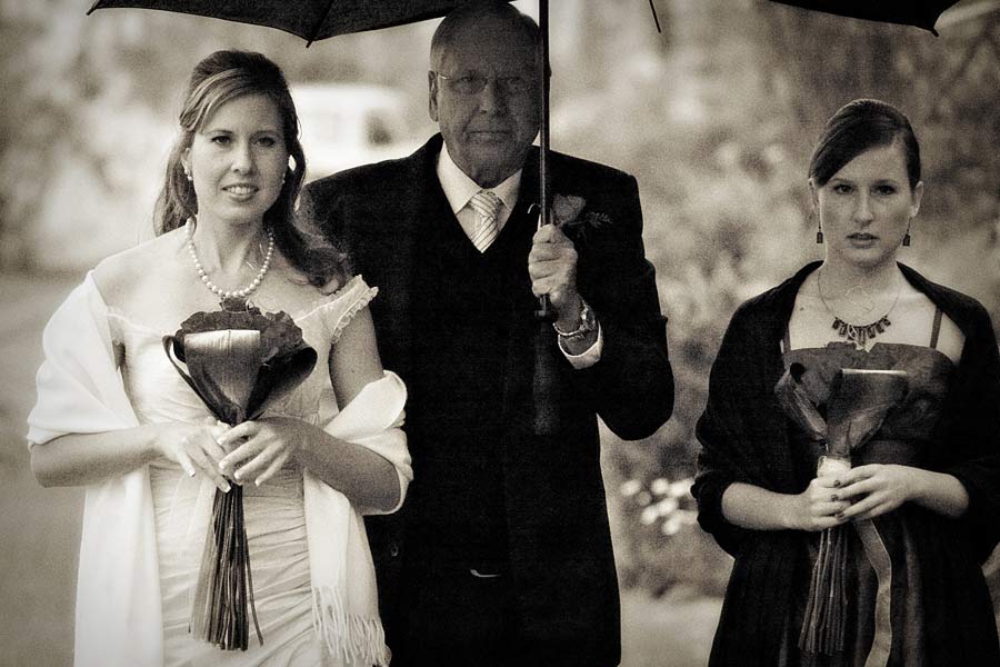 Bride and Father walking up to the church to get married