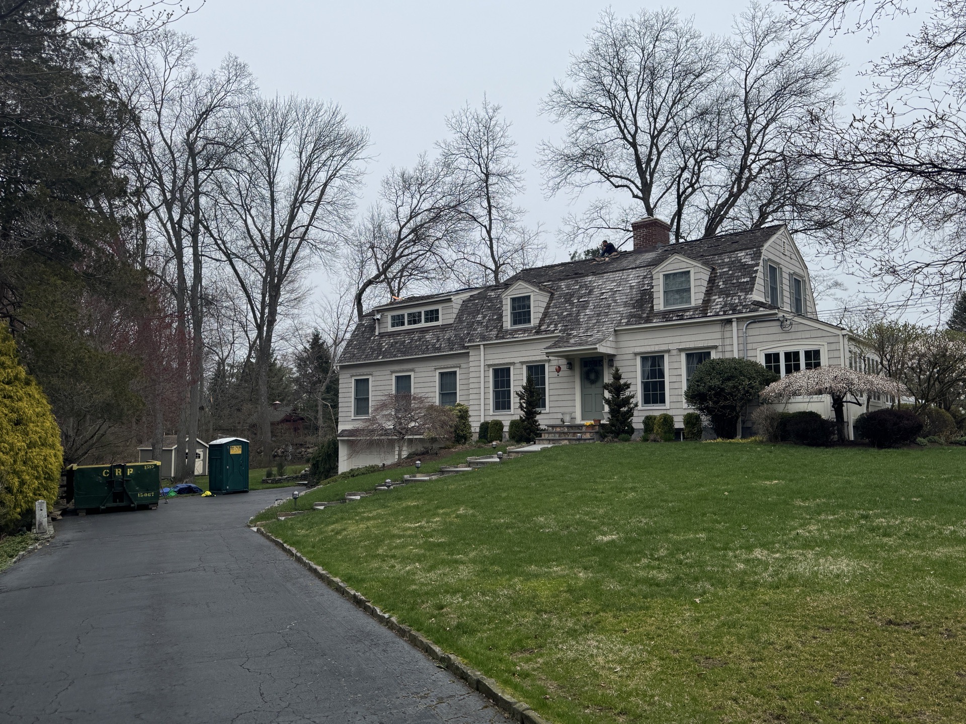 Roofing crew working on a storm-damaged home in Harrisburg, PA