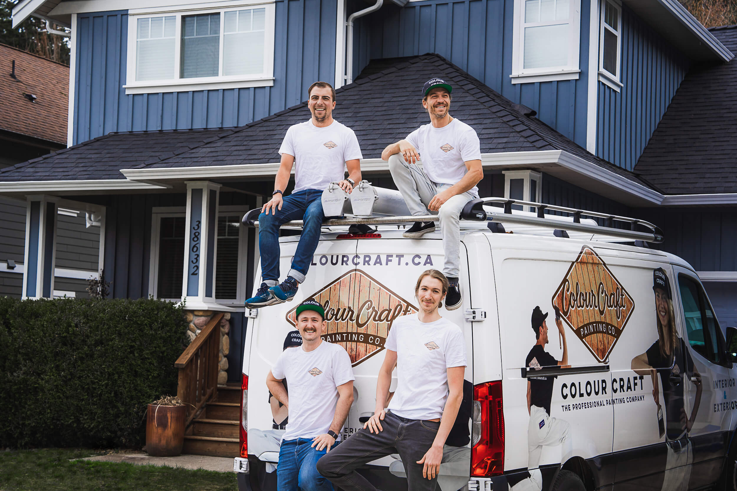 This image depicts a group from Colour Craft Painting, relaxed and cheerful, indicating a successful project completion. Their teamwork and positive company culture are front and center, making this a compelling representation of lifestyle photography for the business.