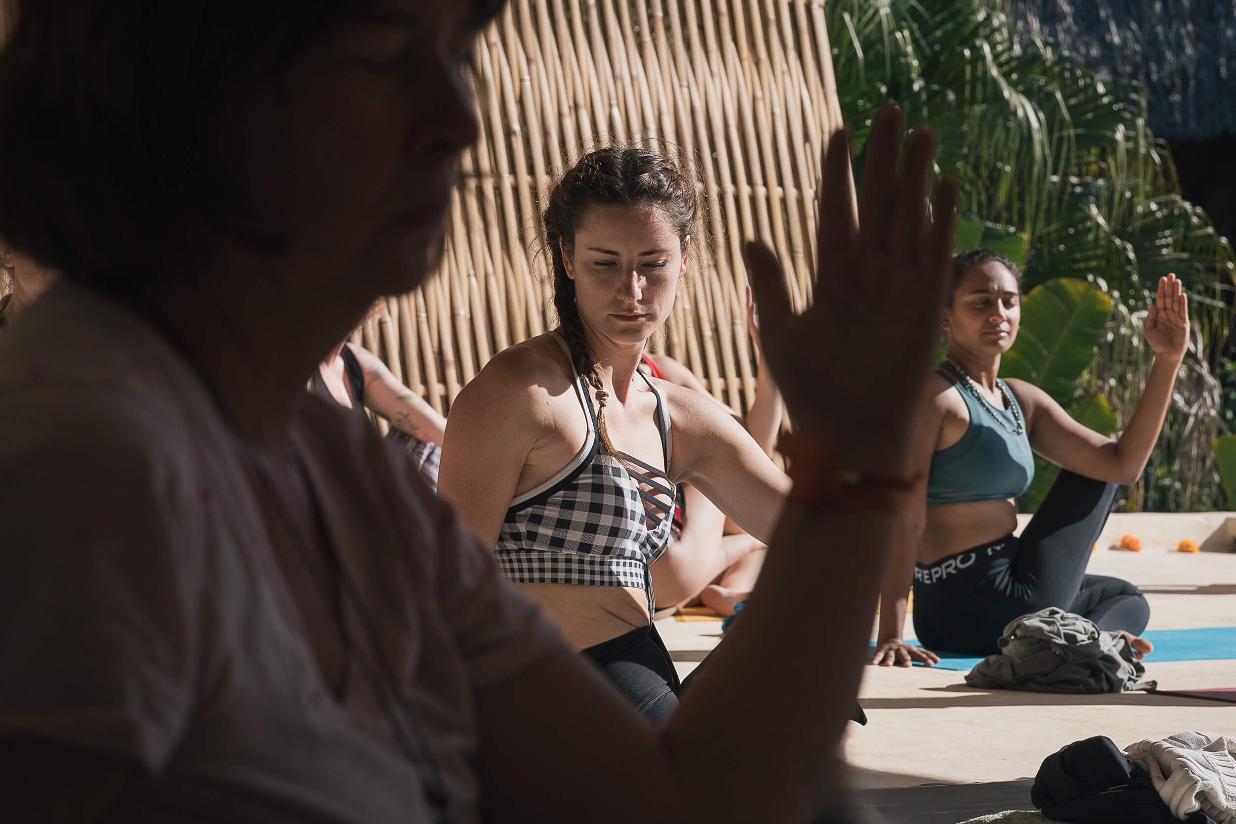 Focused group meditation during a yoga retreat in Mexico, photographed by Matt Anthony Photography, showcasing the depth of mindful practice for serene lifestyle imagery.