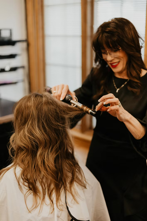 Jen curling hair