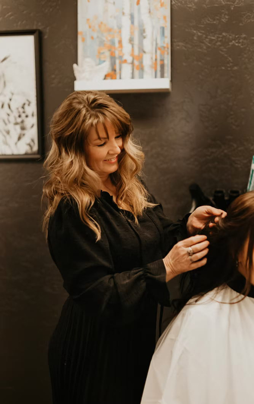 Shawna styling client's hair