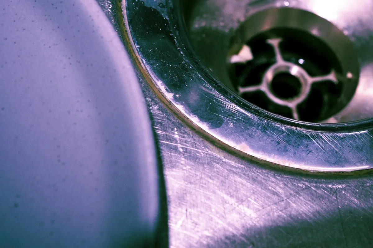 Close-up of a stainless steel sink drain
