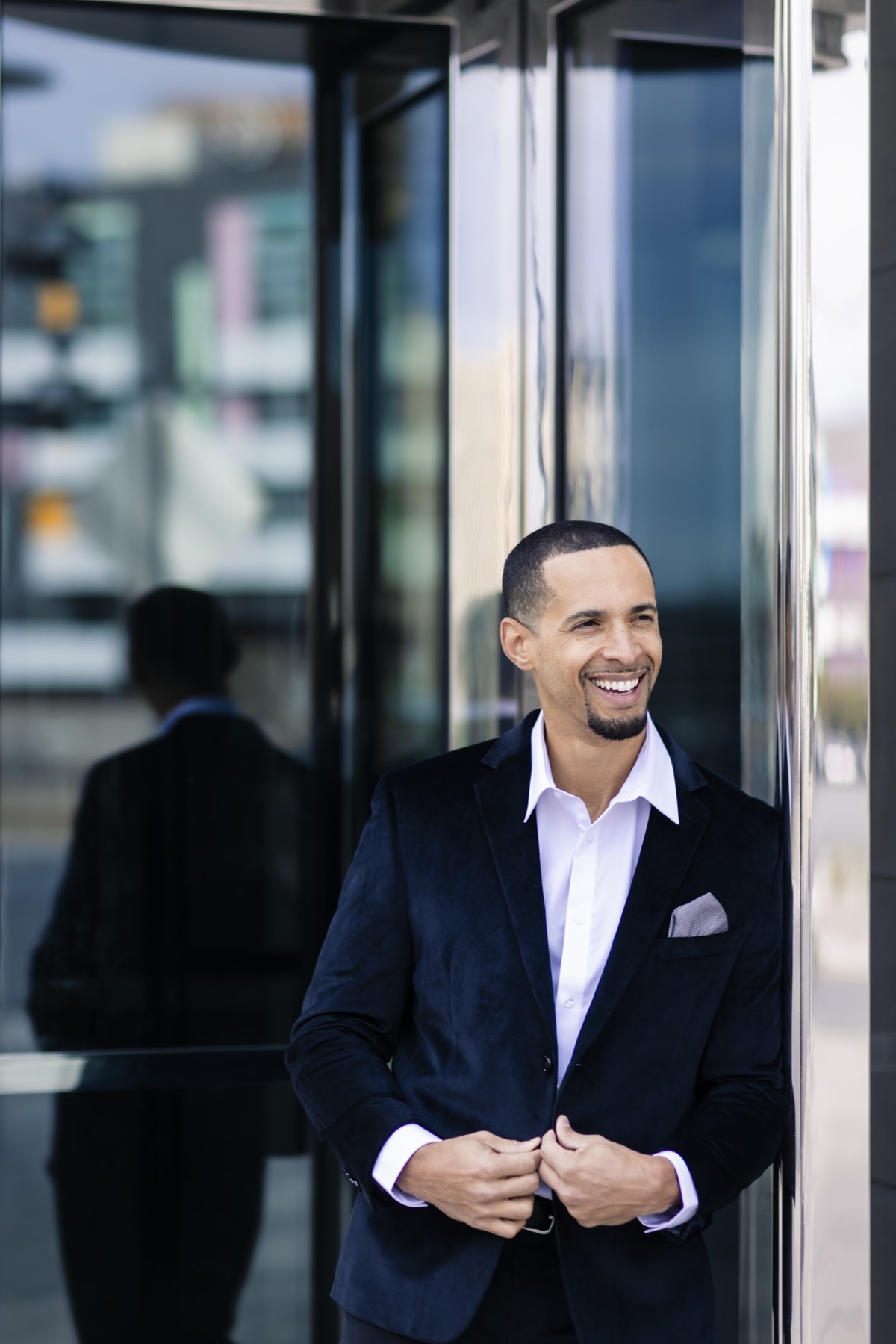 Steve Rolle smiling in a black blazer