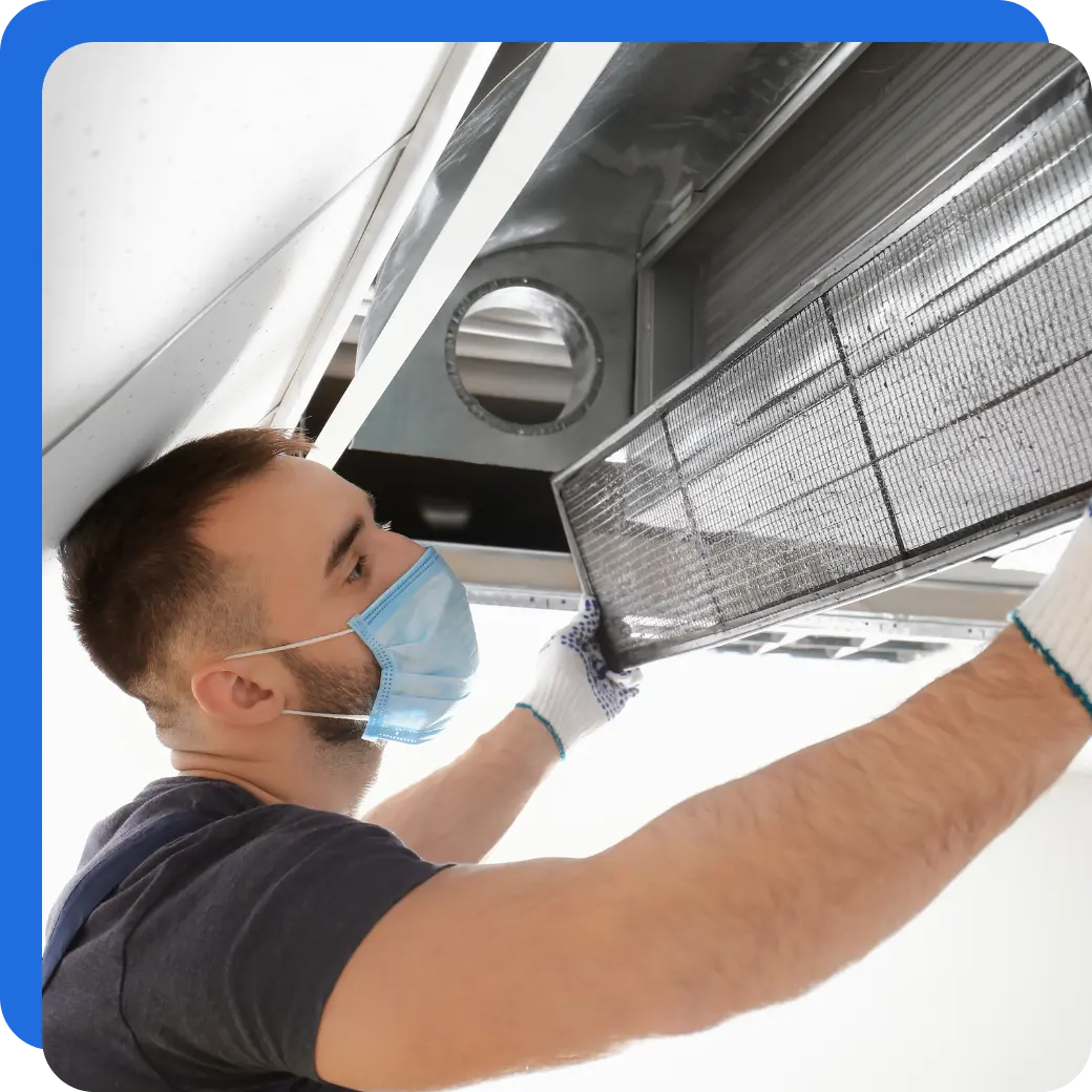 AC technician fixing the aircon