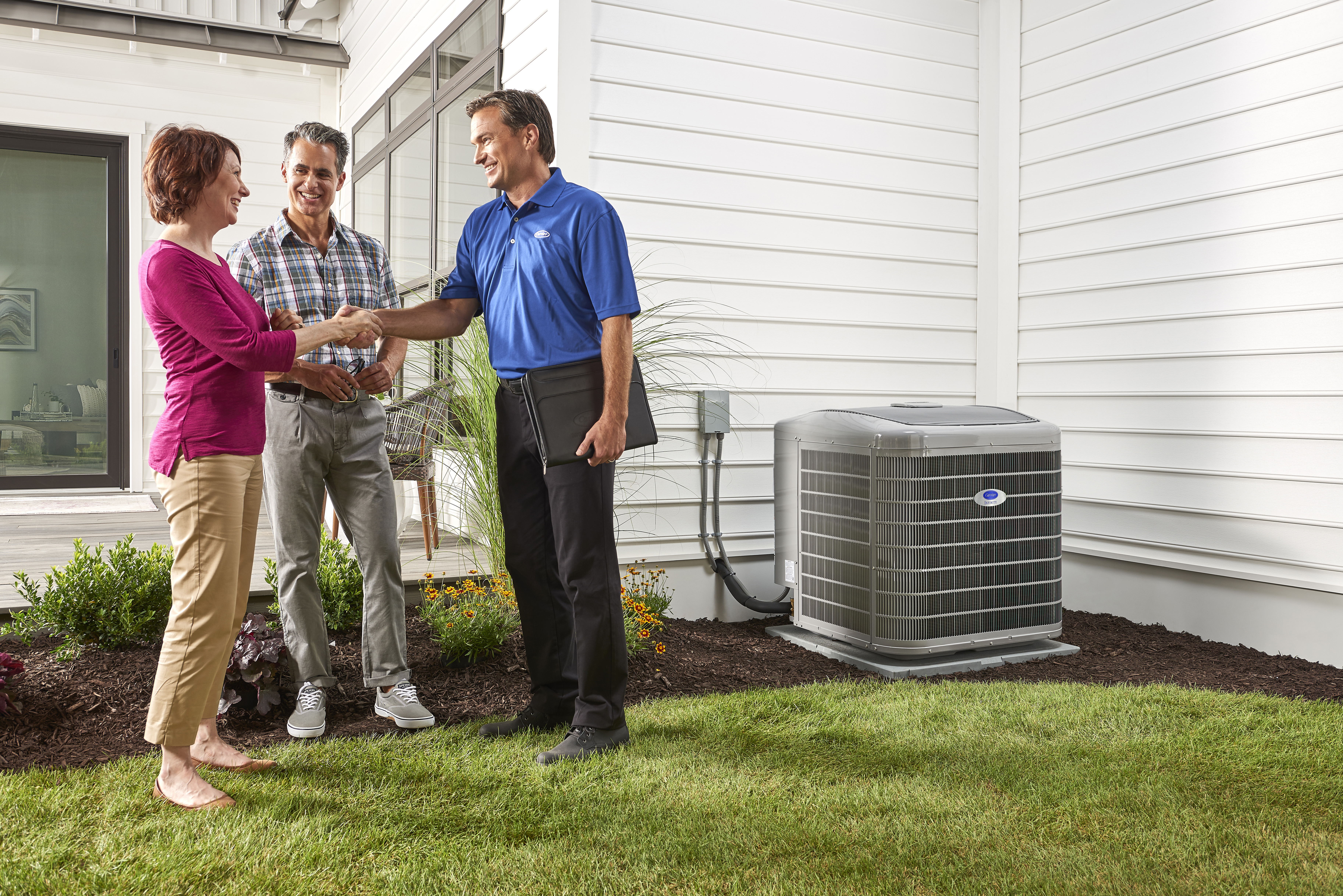 AC repair technician working on a unit in Coquitlam