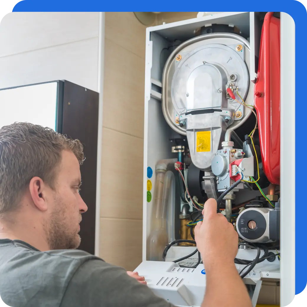 a technician fixing a boiler