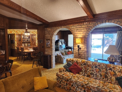 Dated home interior before renovation showing outdated kitchen and finishes