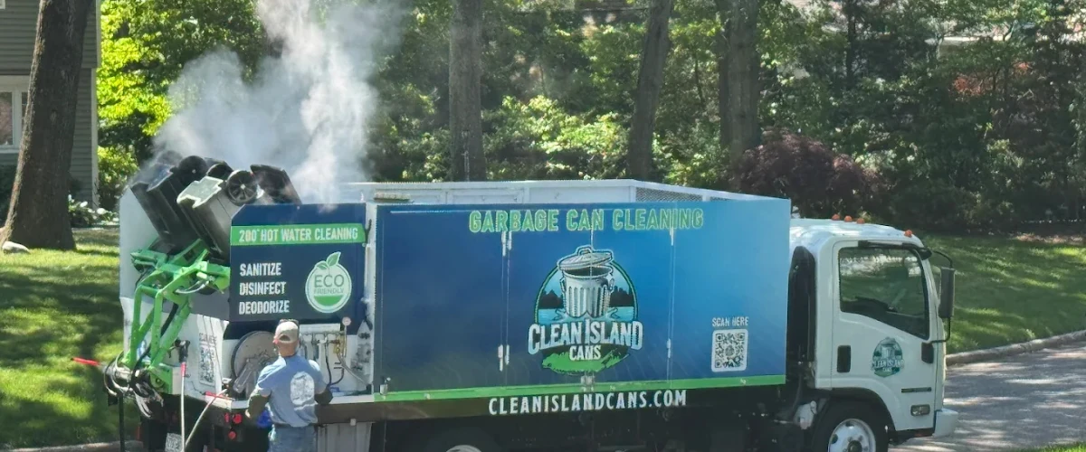 Garbage can cleaning truck operating with hot water sanitation system