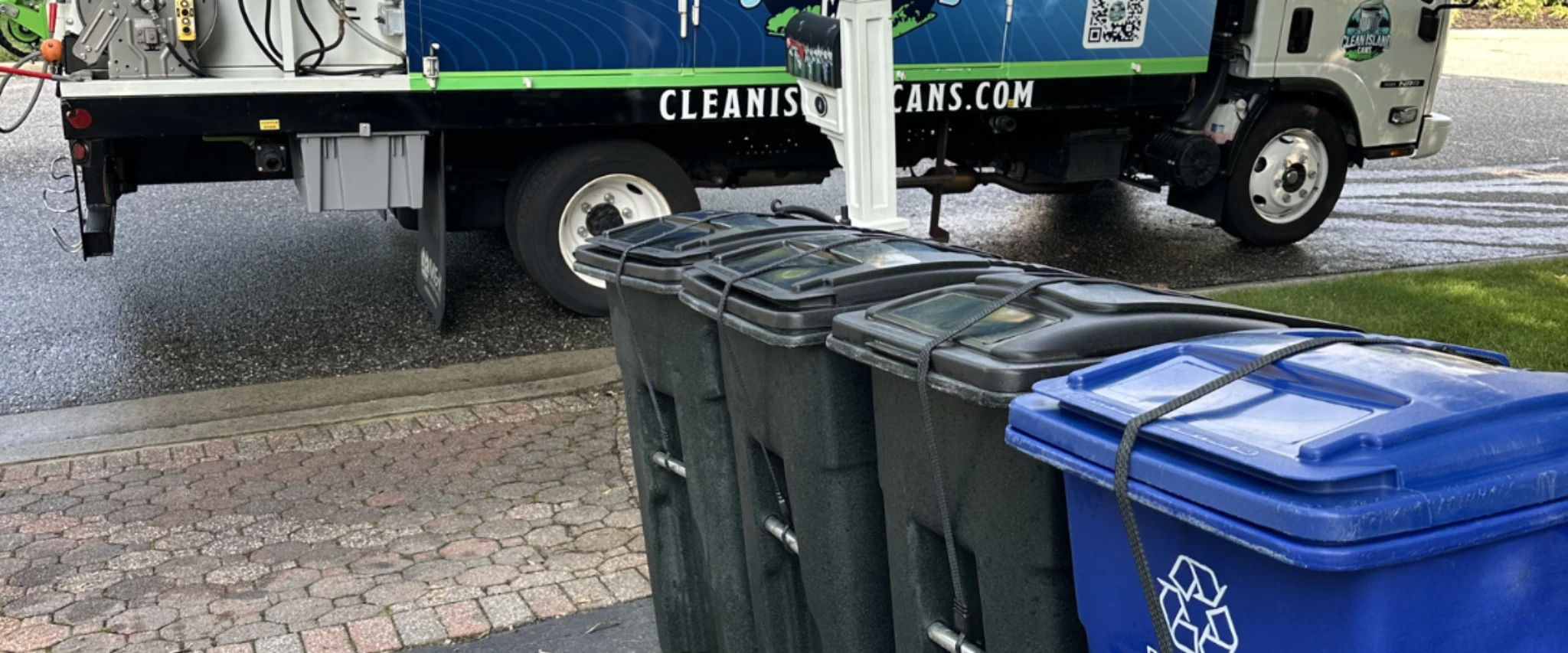 Trash and recycling bins secured and staged for cleaning service