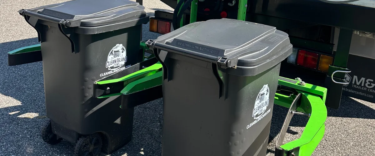 Two Clean Island Cans trash bins secured by lime green cleaning equipment, seen from a high angle. Two Clean Island Cans trash bins secured by lime green cleaning equipment, seen from a high angle.