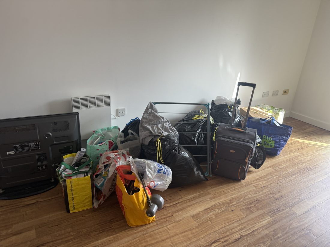 Packed bags, suitcase, television and household belongings from our moving work