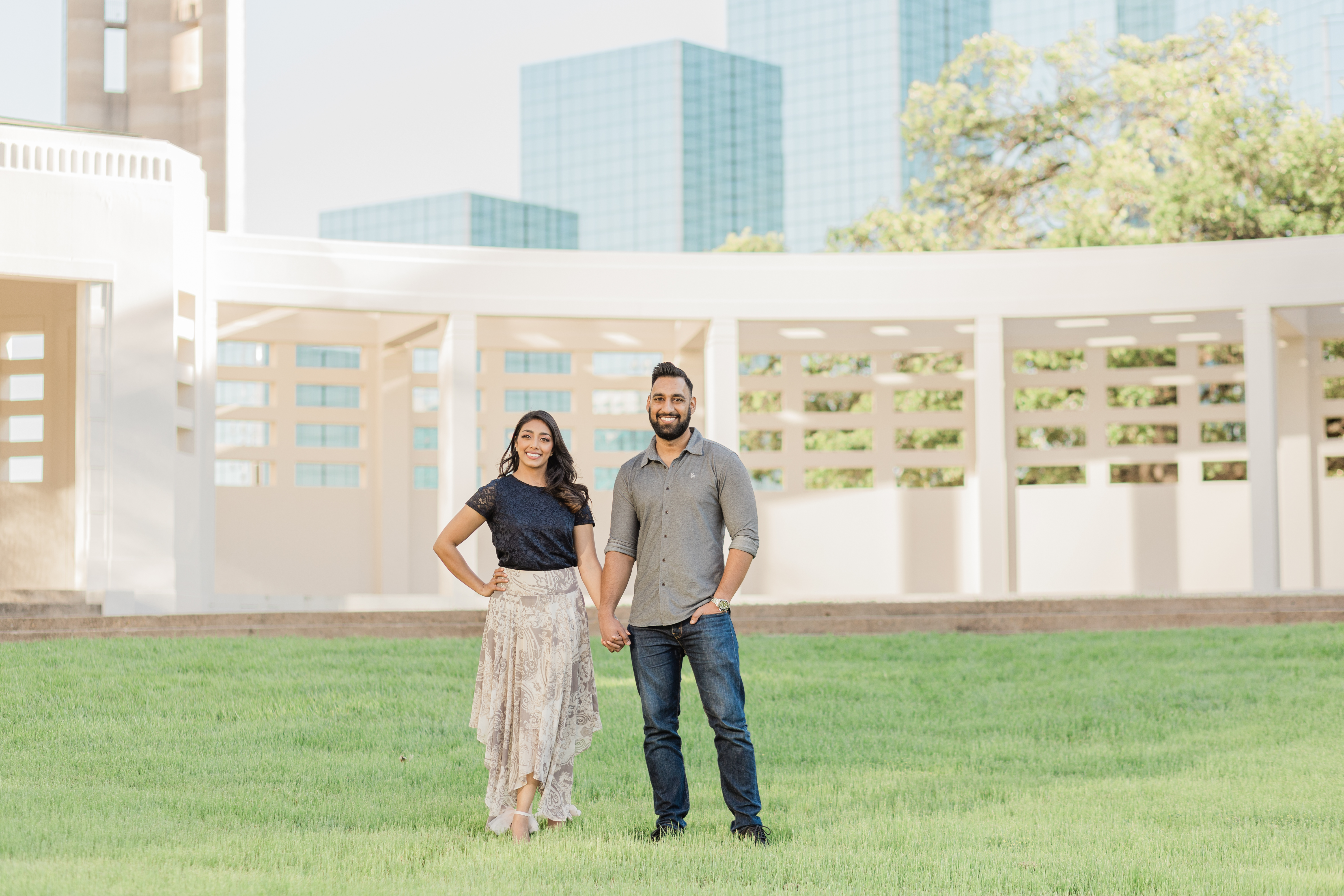 Image of a couple with the iconic Reunion Tower and Omni Hotel in Dallas, Texas in he backdrop behind them taken by Dallas wedding photographer, Arlene Stepanian Photography.