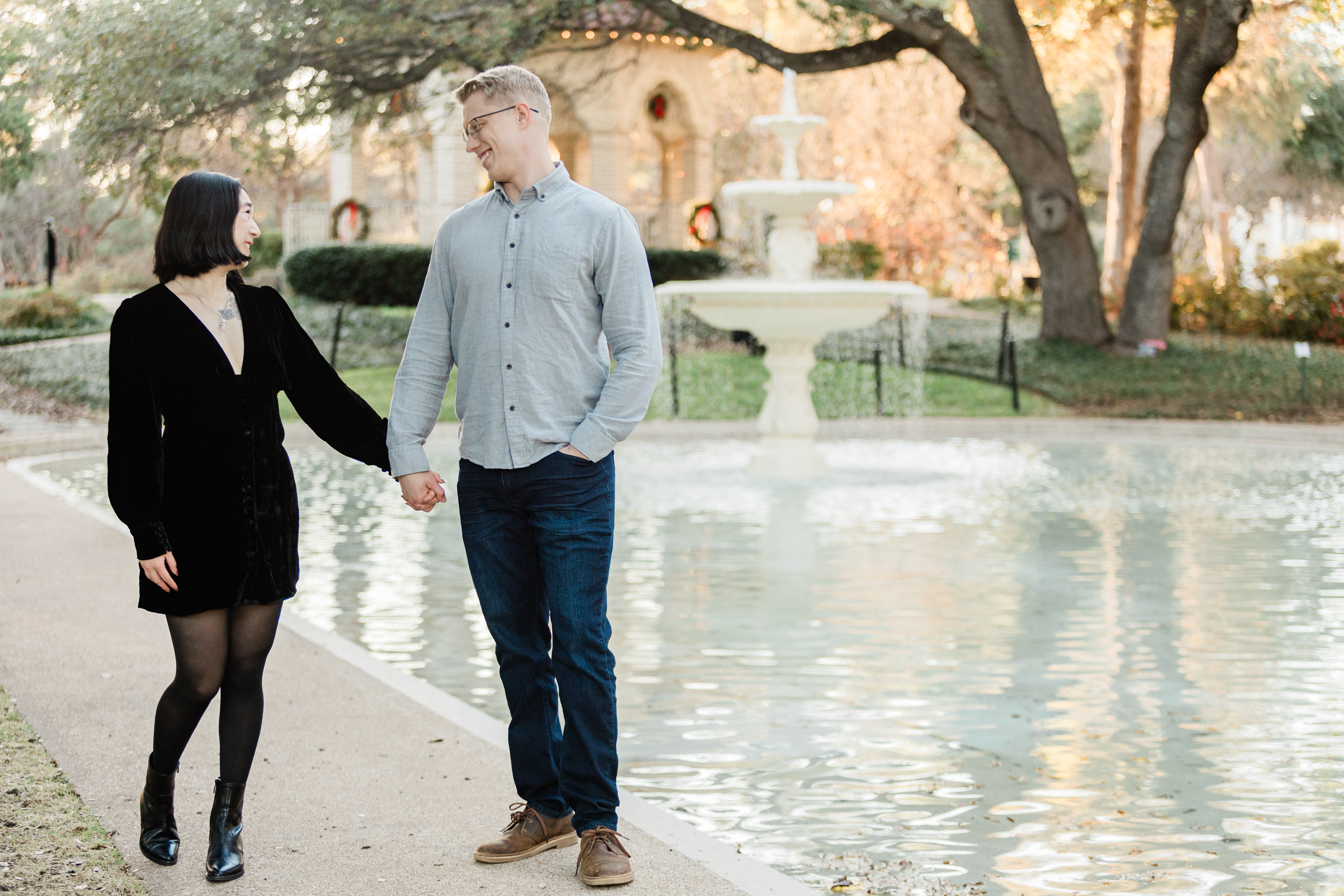 A picture of a couple right after their surprise proposal in Flippen Park in  Highland Park Dallas by wedding photographer, Arlene Stepanian.