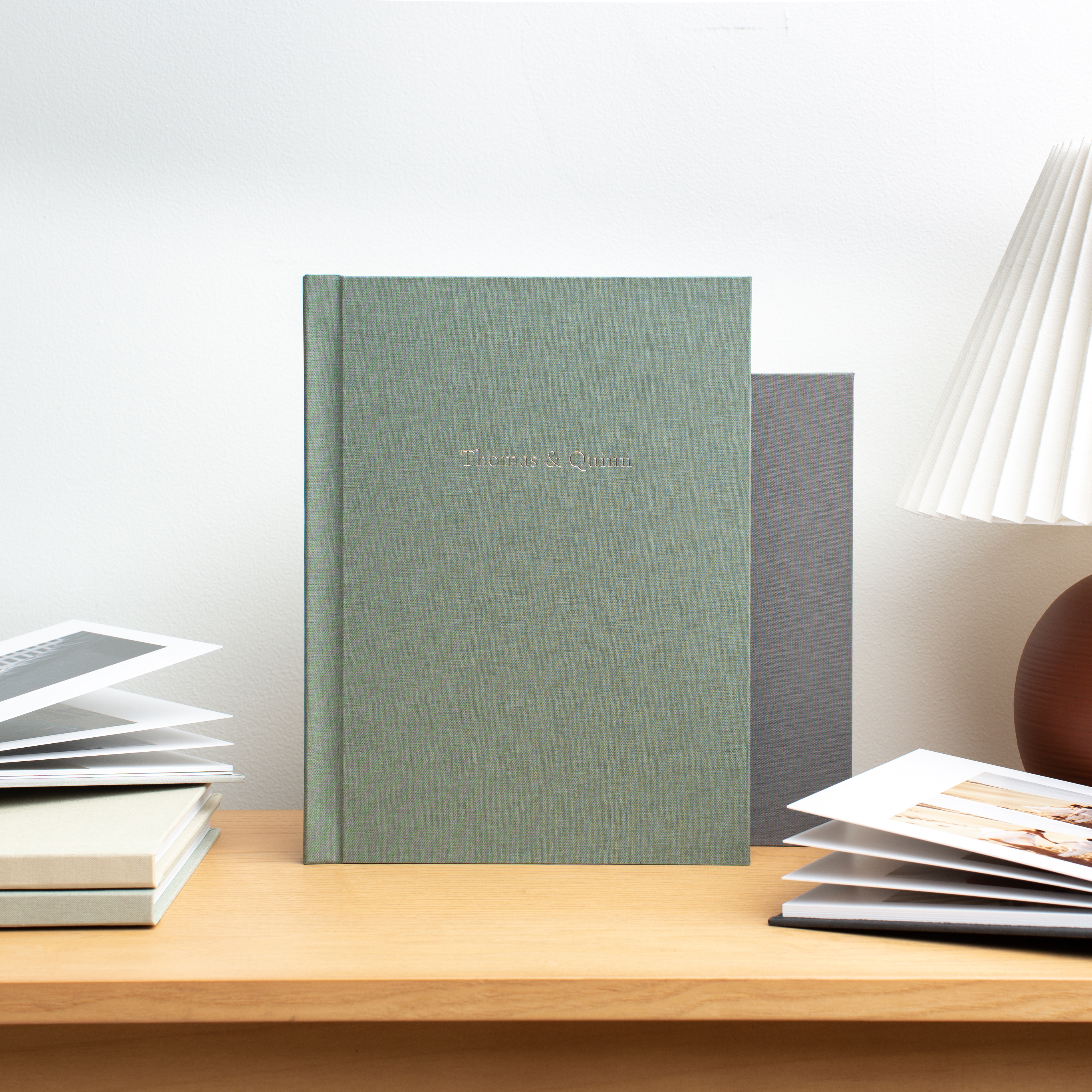 Image of photo albums on a shelf.