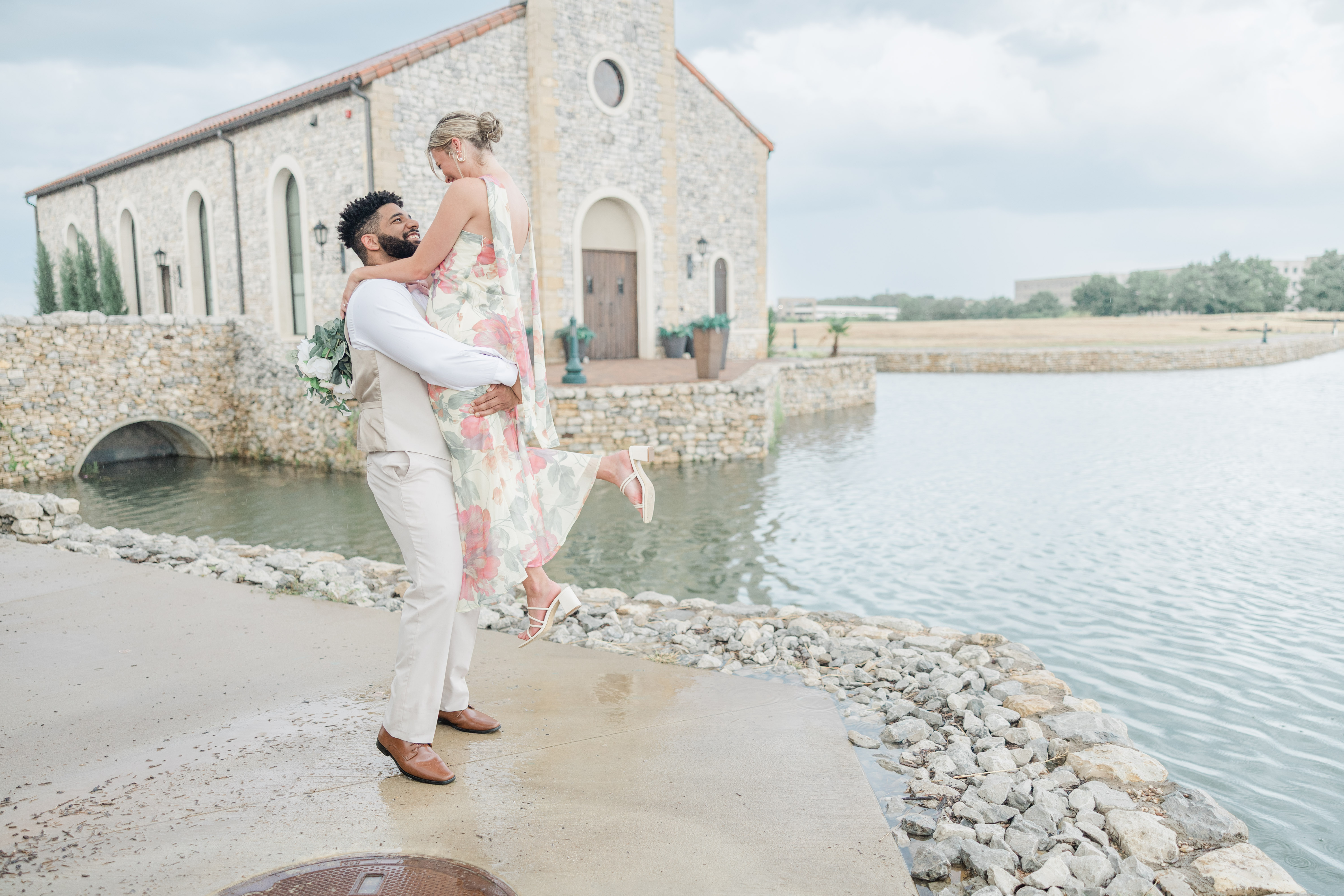 Image of a couple in. front of The Palacios Chapel at Entrada Village in Westlake, Texas.