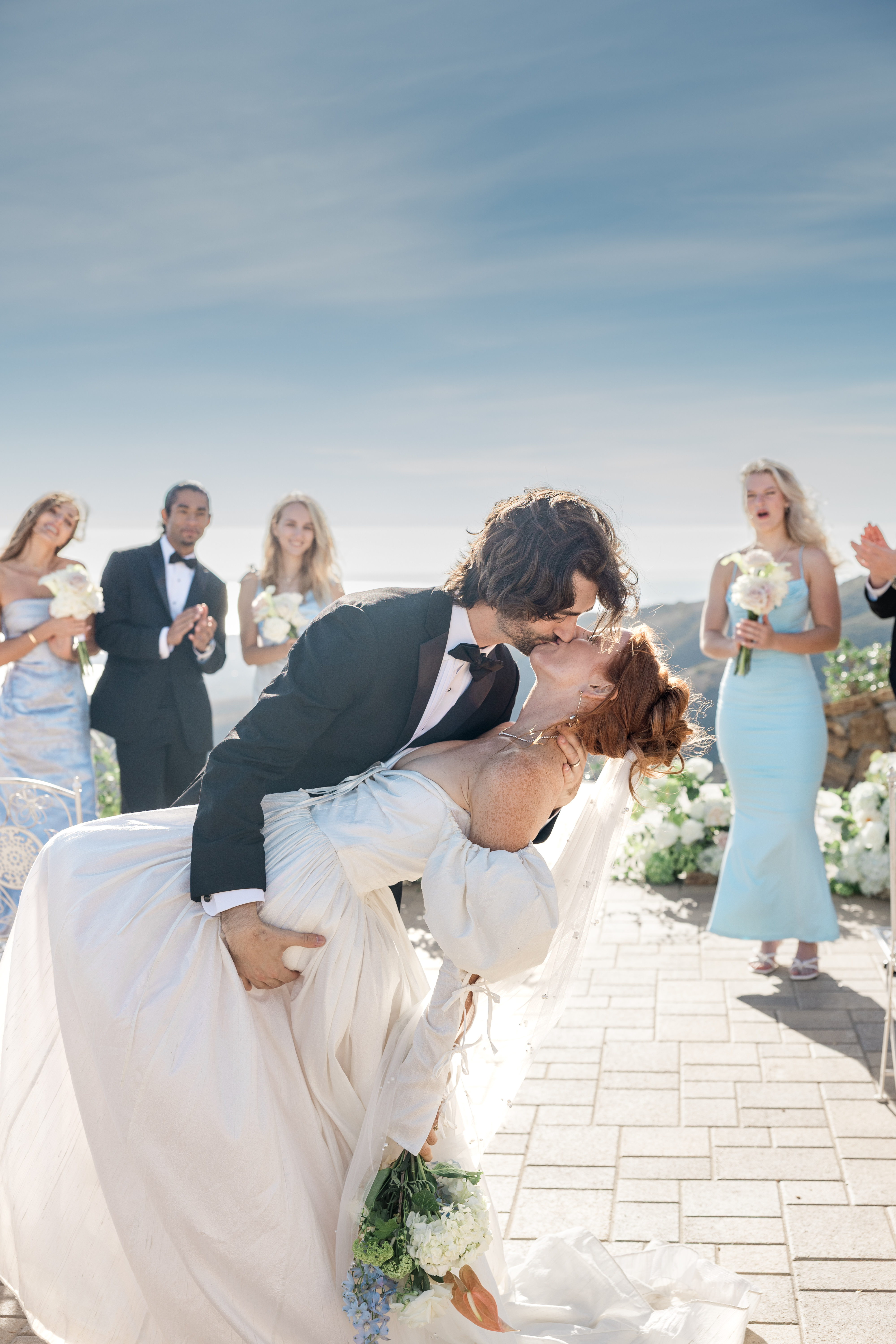 Bride and Groom sitting in the parlor sitting in an antique conversation chair at The Lone Star Mansion in Burleson, Tx.