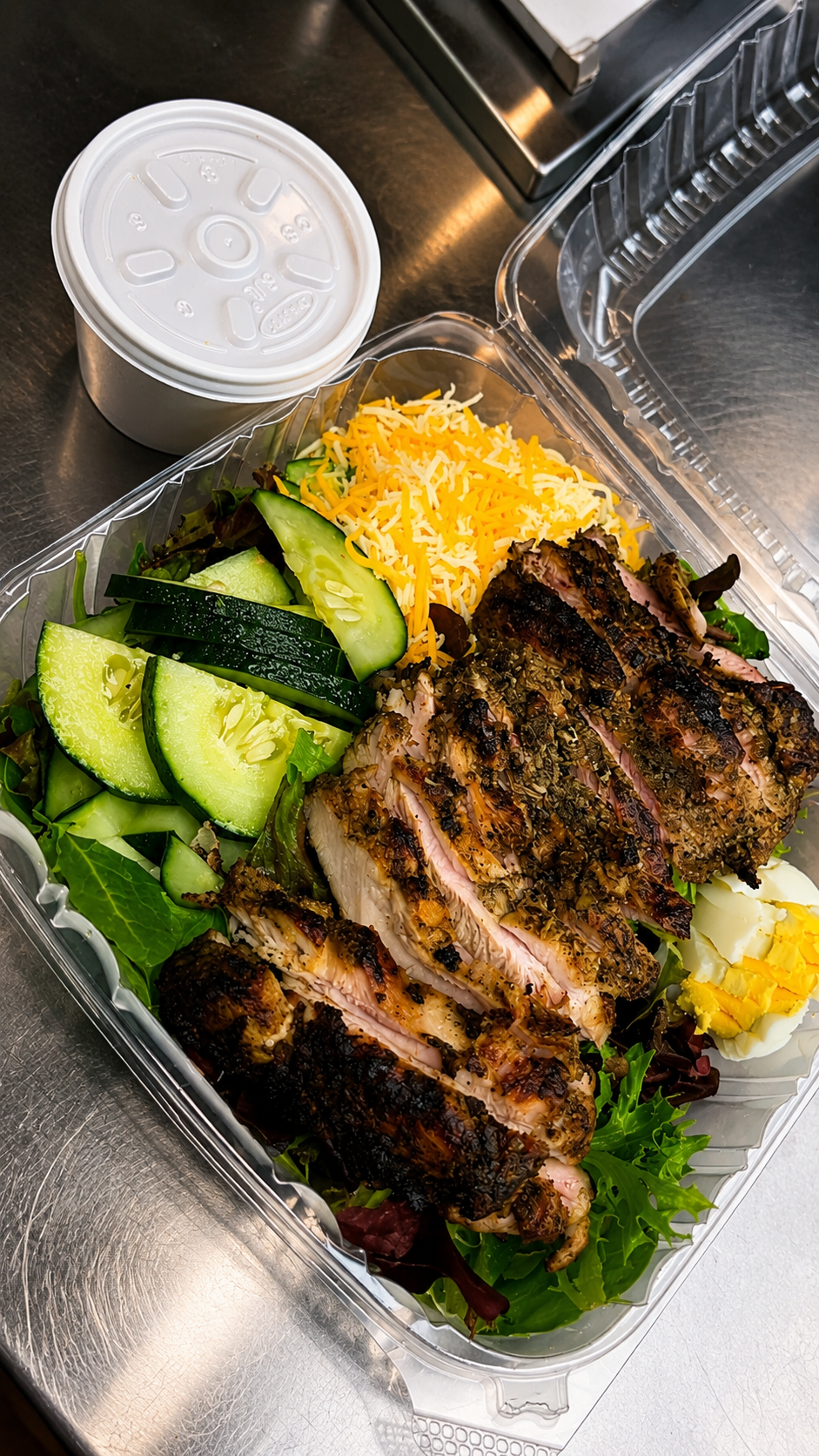 Jerk chicken plate with fresh sides
