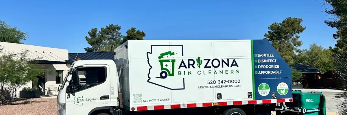 Arizona Bin Cleaners owner standing beside branded bin cleaning truck.