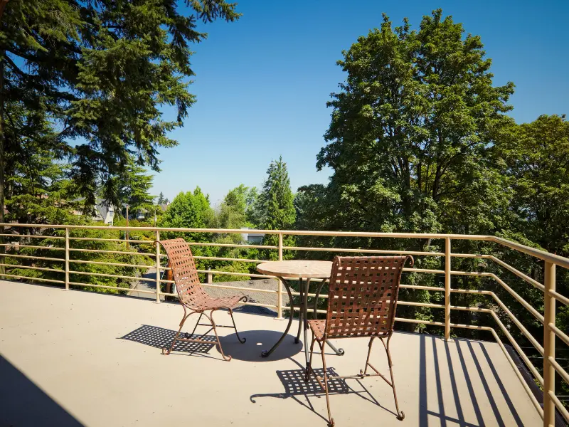 Rooftop deck with seating overlooking trees, an example of a financed deck project.