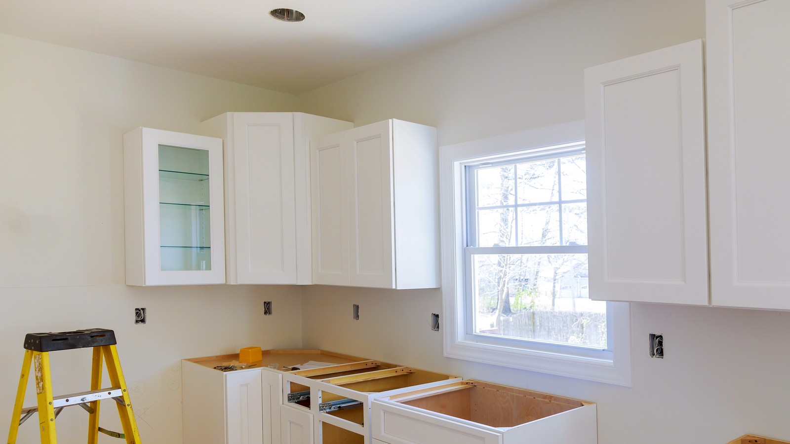 A kitchen mid-renovation with new cabinets partly installed