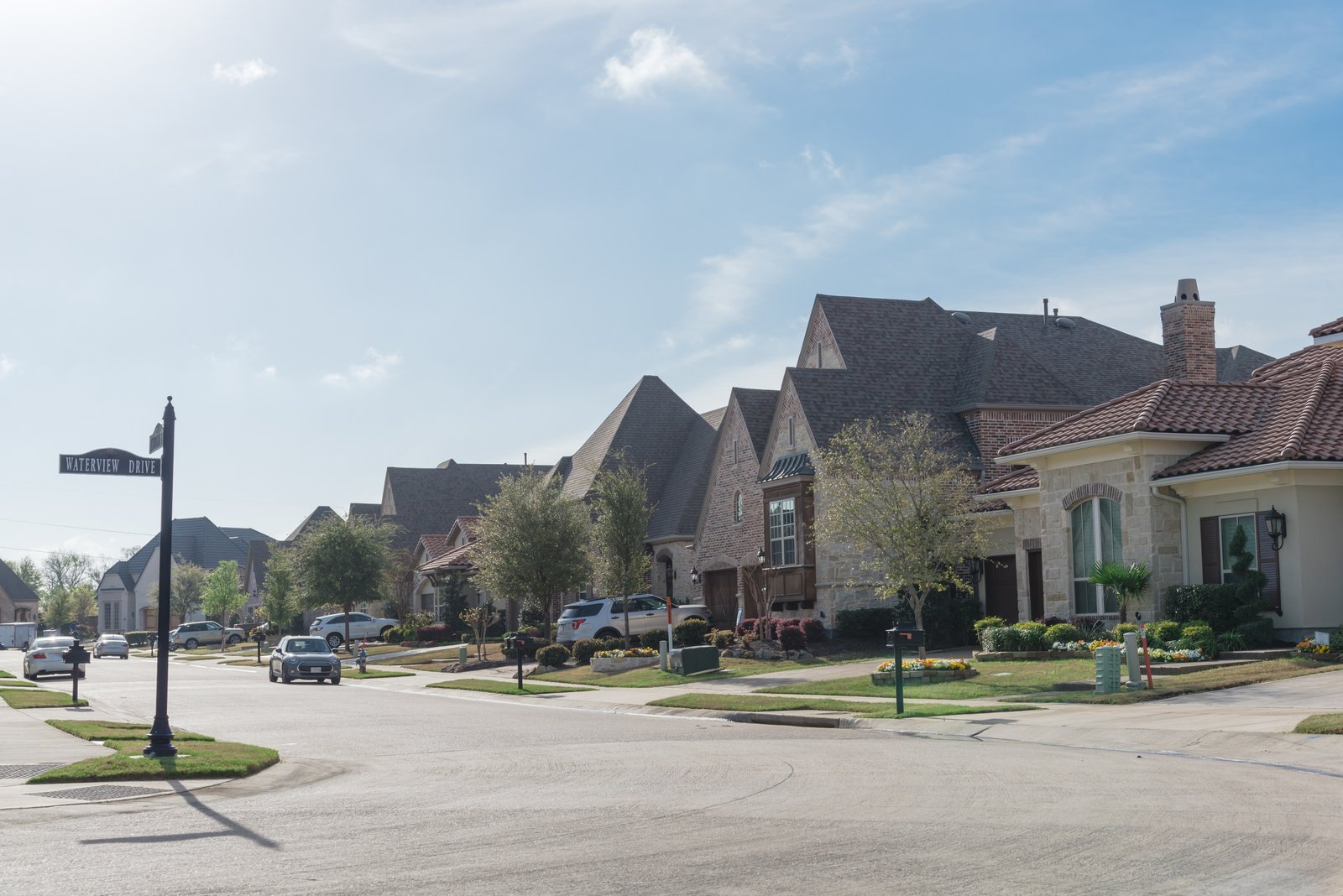 A street of two-story houses in a Texas suburb