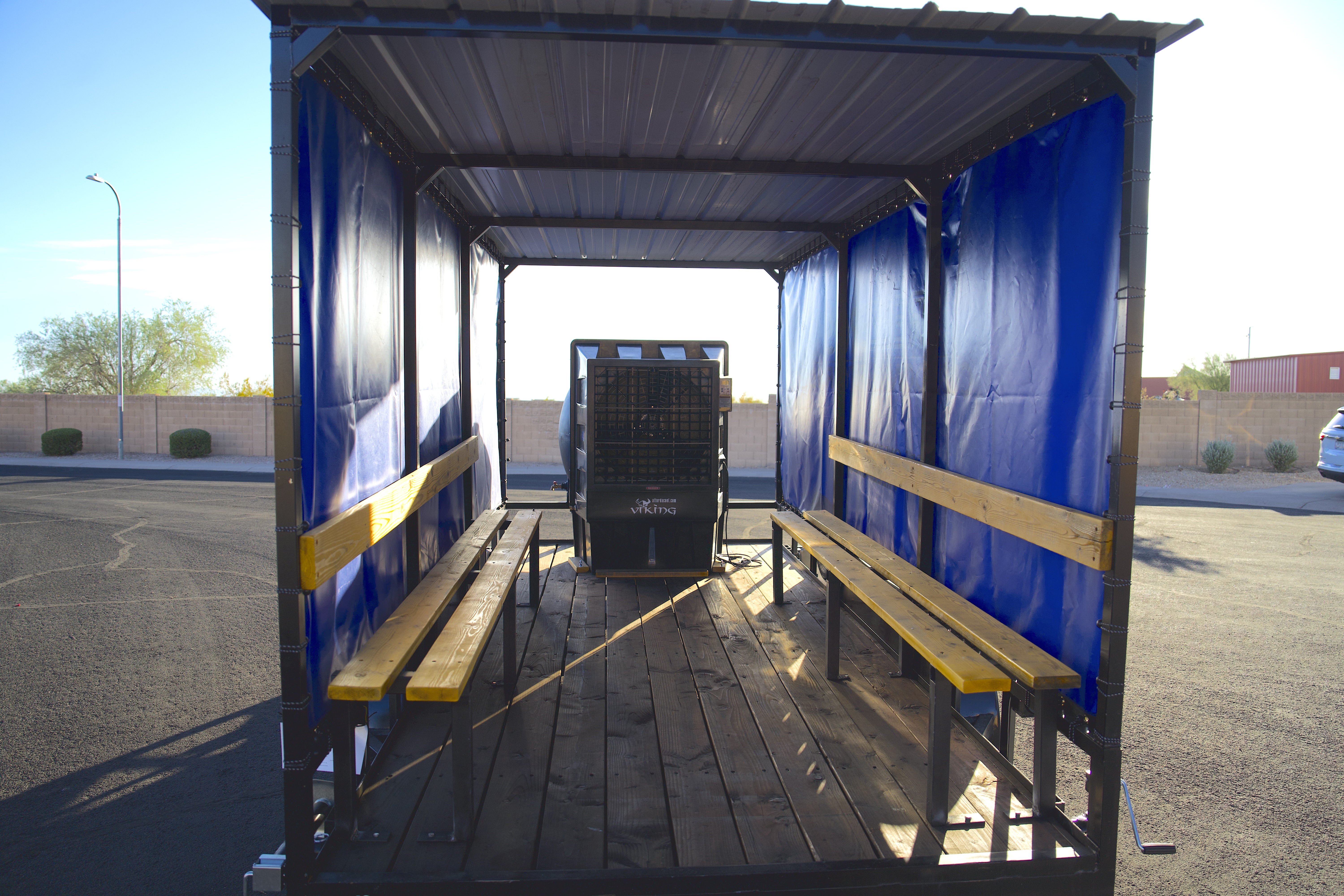 Evaporative cooling trailer — interior bench seating and 3,000 CFM cooler