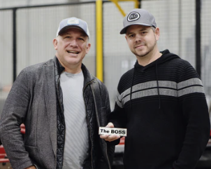 Two founders walking through their shop floor