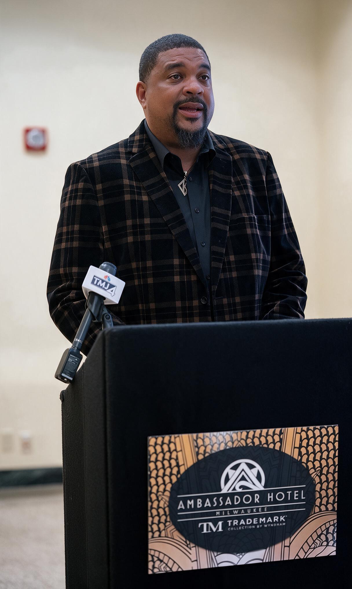 Ahmed Hollowell at the Ambassador Hotel podium