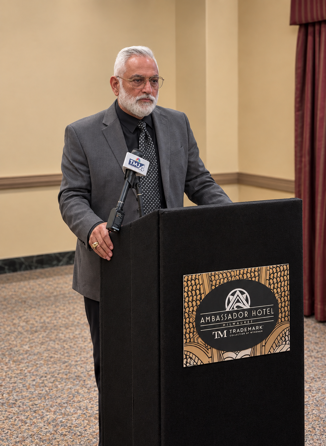 CEO Manny Matsakis at the Ambassador Hotel podium in Milwaukee