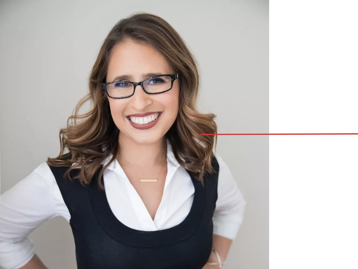 Ilana, motherhood coach and grief support specialist, looking directly at the camera