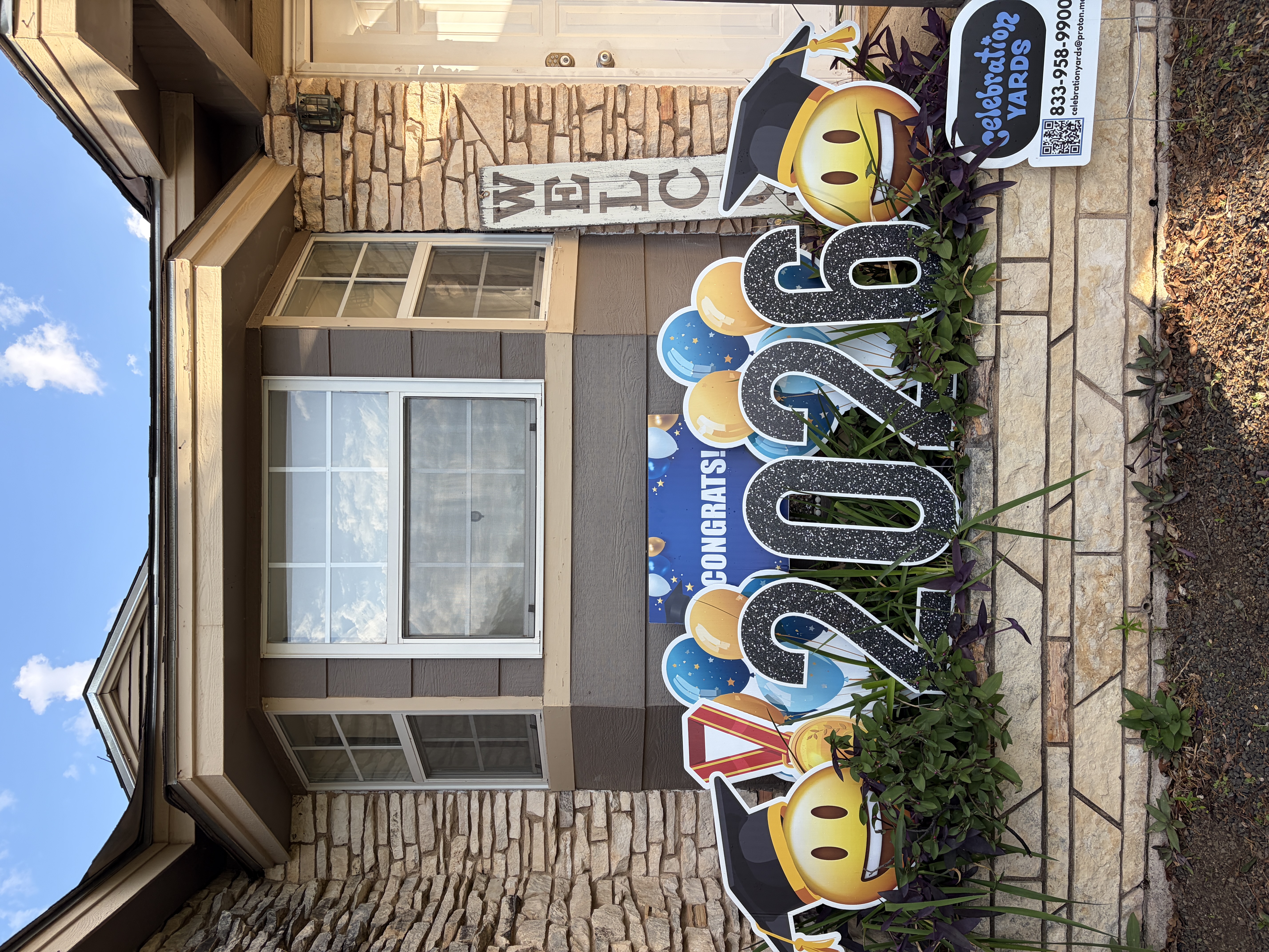 Real graduation congrats yard display for the Class of 2026 with balloons