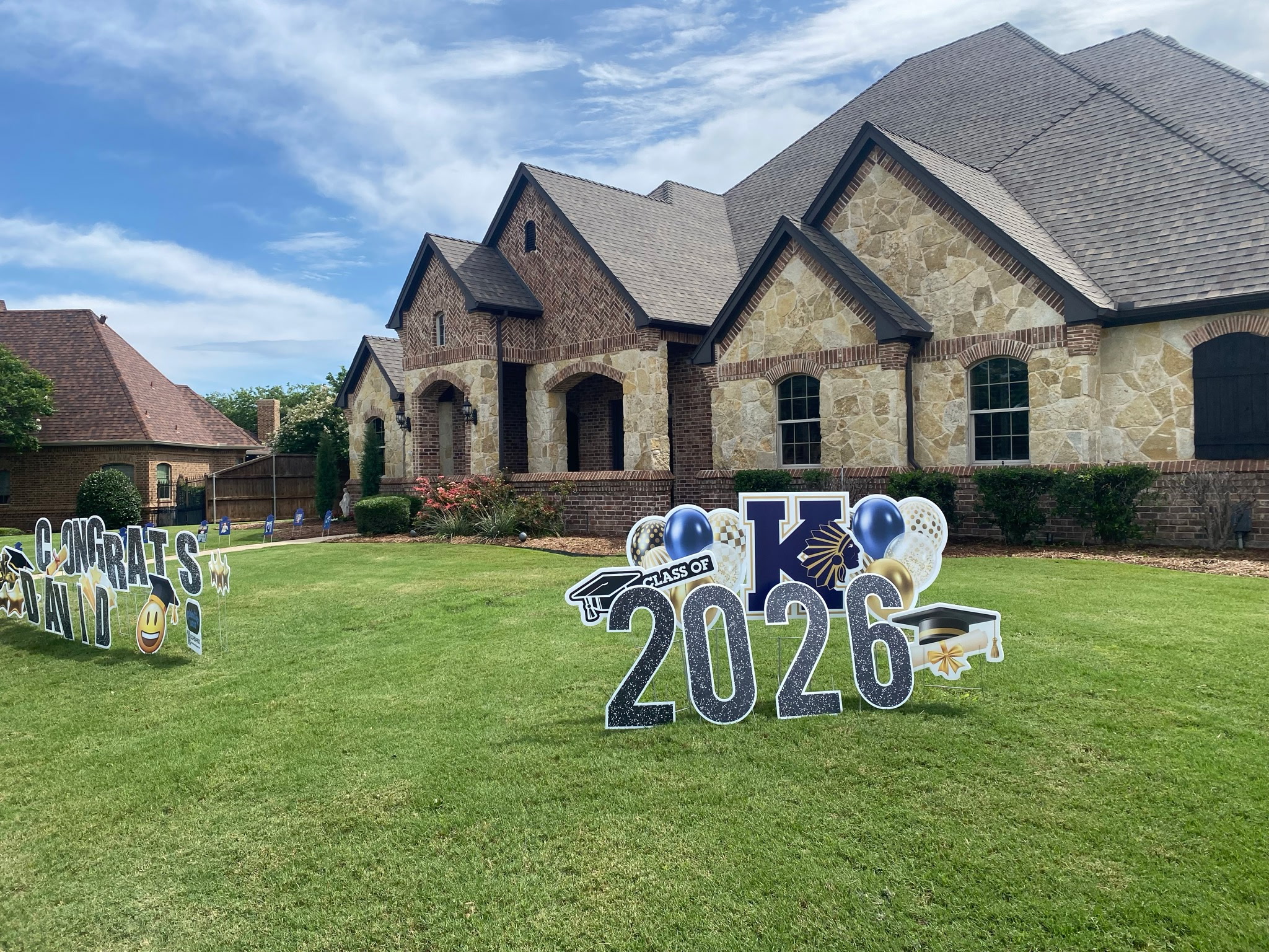 Real double graduation yard display, Congrats David and Class of 2026