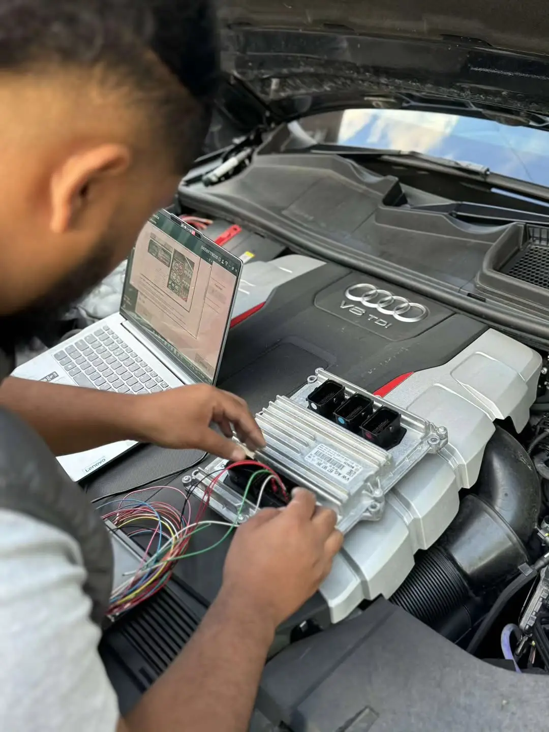 Riz writing a file on the laptop, plugged into the car