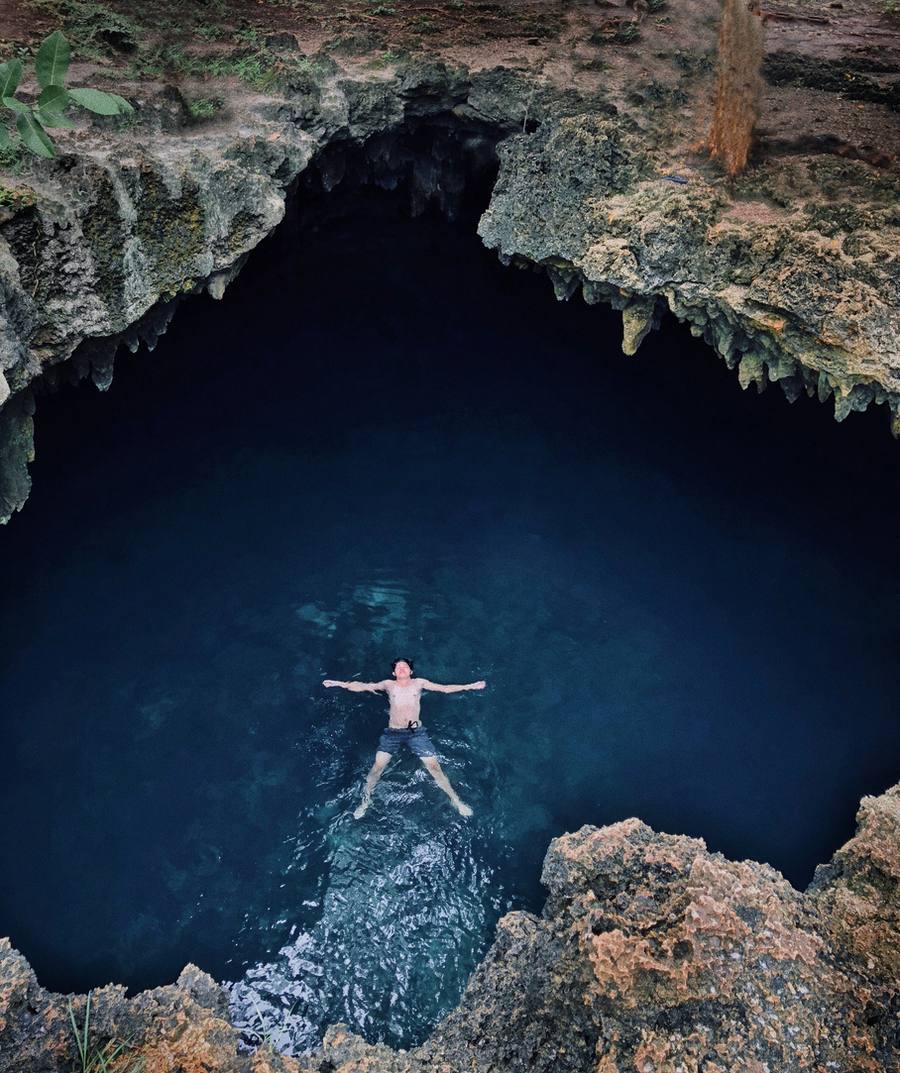 Person floating in a cenote