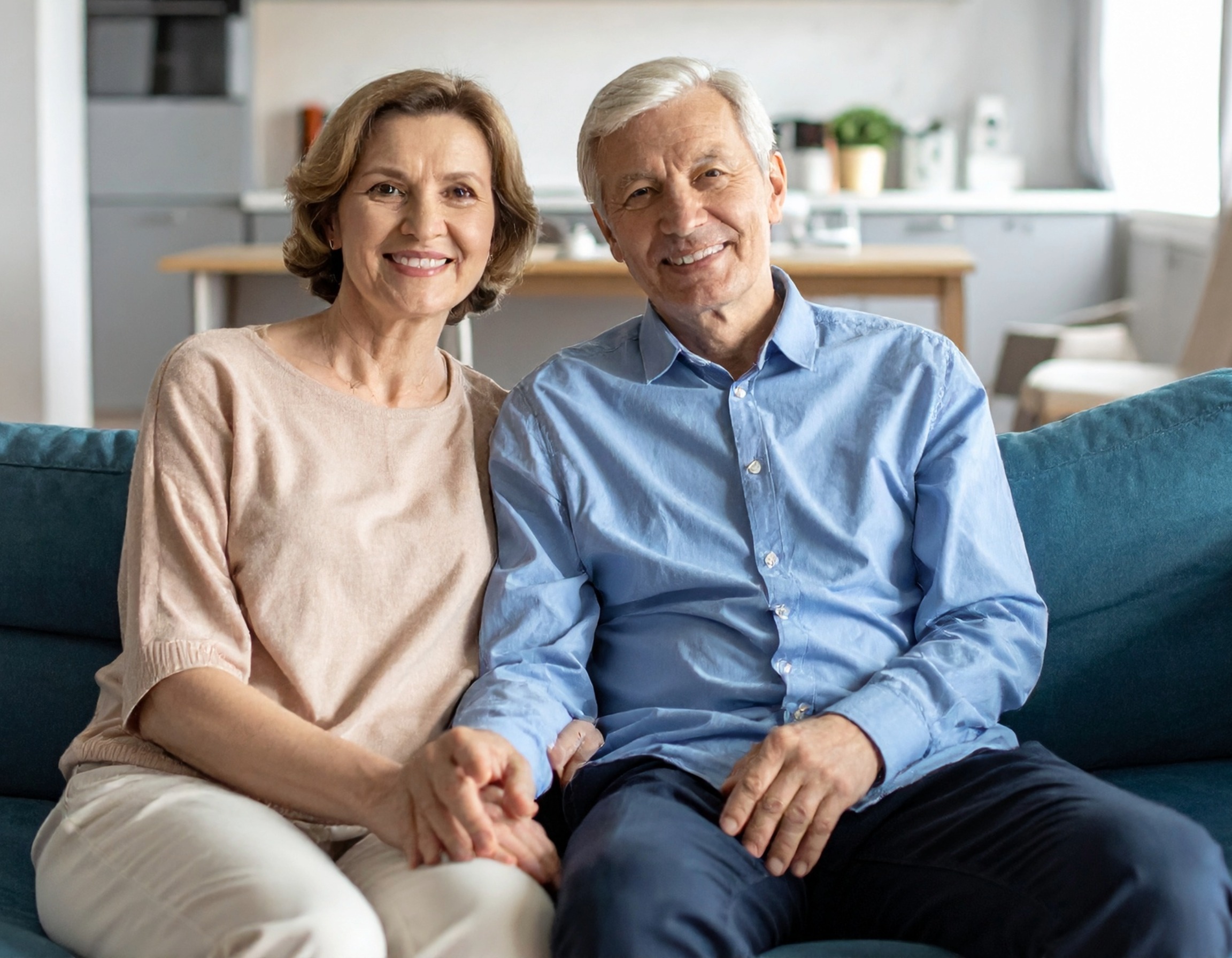Smiling older couple reviewing final expense insurance options