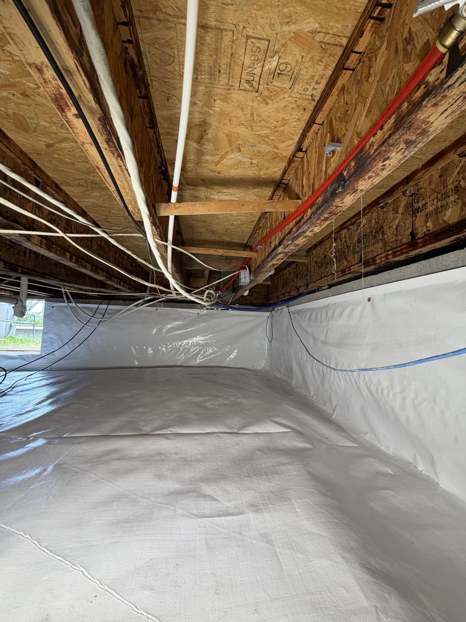 Crawl space mold remediation and sealed vapor barrier installed by Crawlspace Hero