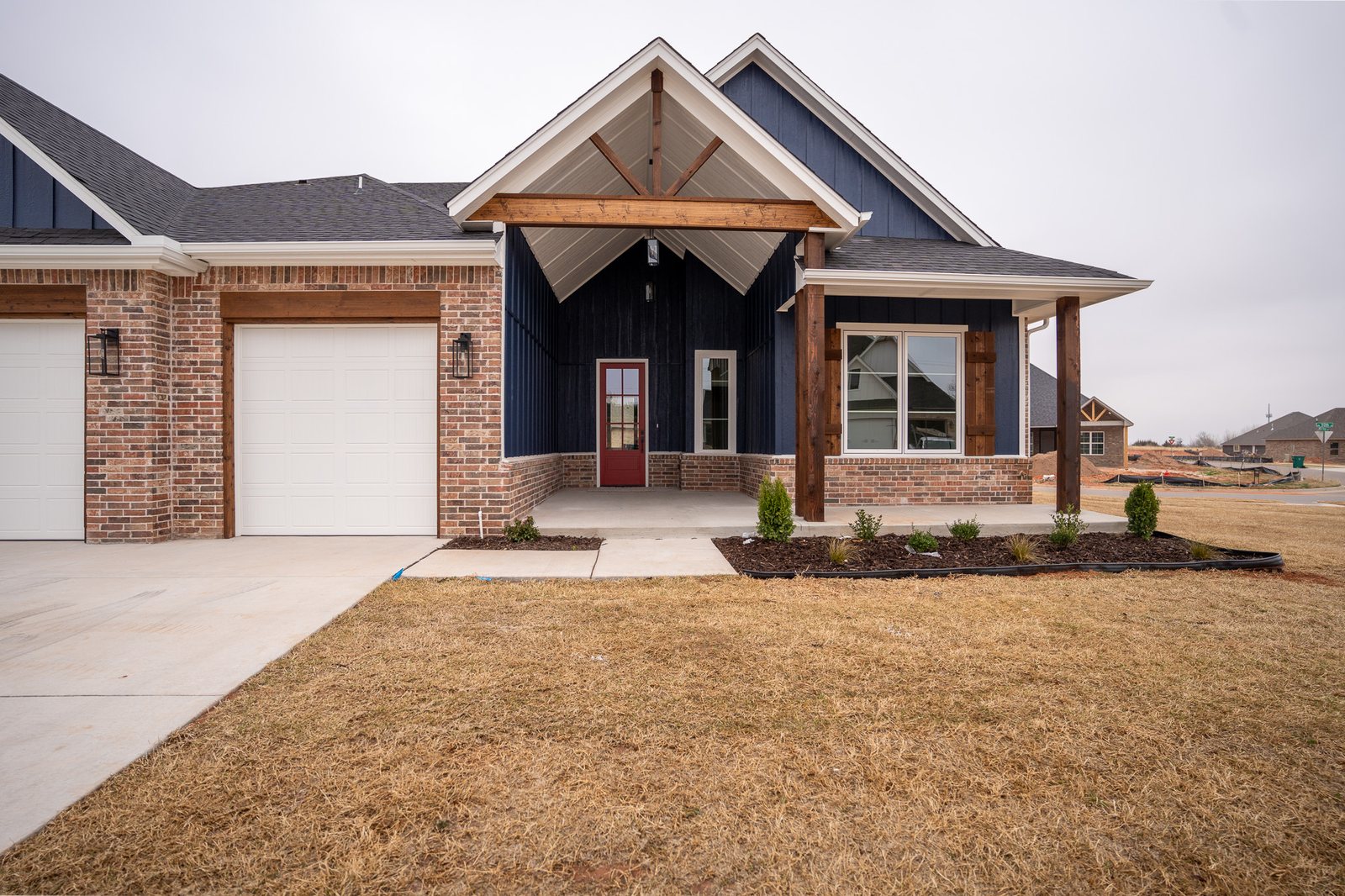 Front exterior of a custom-built Oklahoma home at dusk