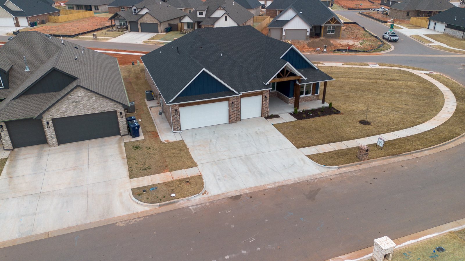 Drone photo of the home and the street it sits on