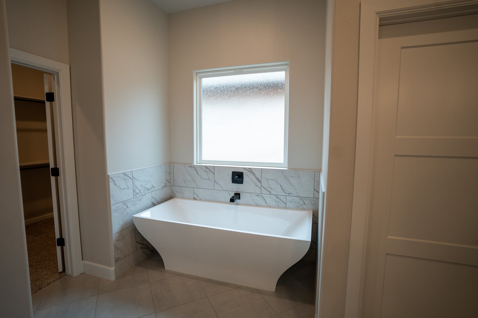 Primary bathroom with a freestanding tub