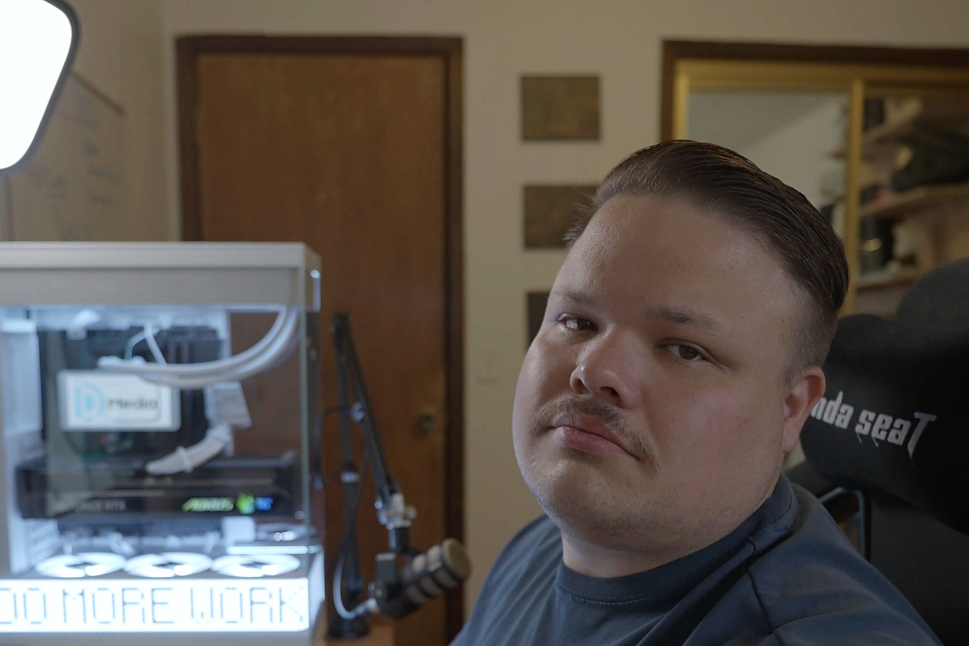 Robert Reiss, owner of Rad Dad Media, editing video at his desk in Oklahoma City