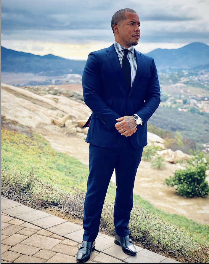 Dr. Chris Cole in a suit outdoors