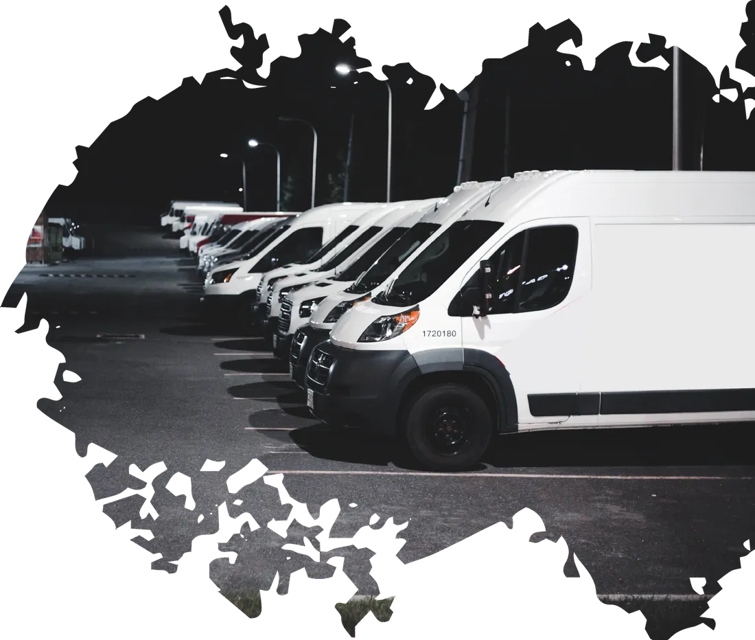 Row of white fleet vans serviced by A&O Auto Care