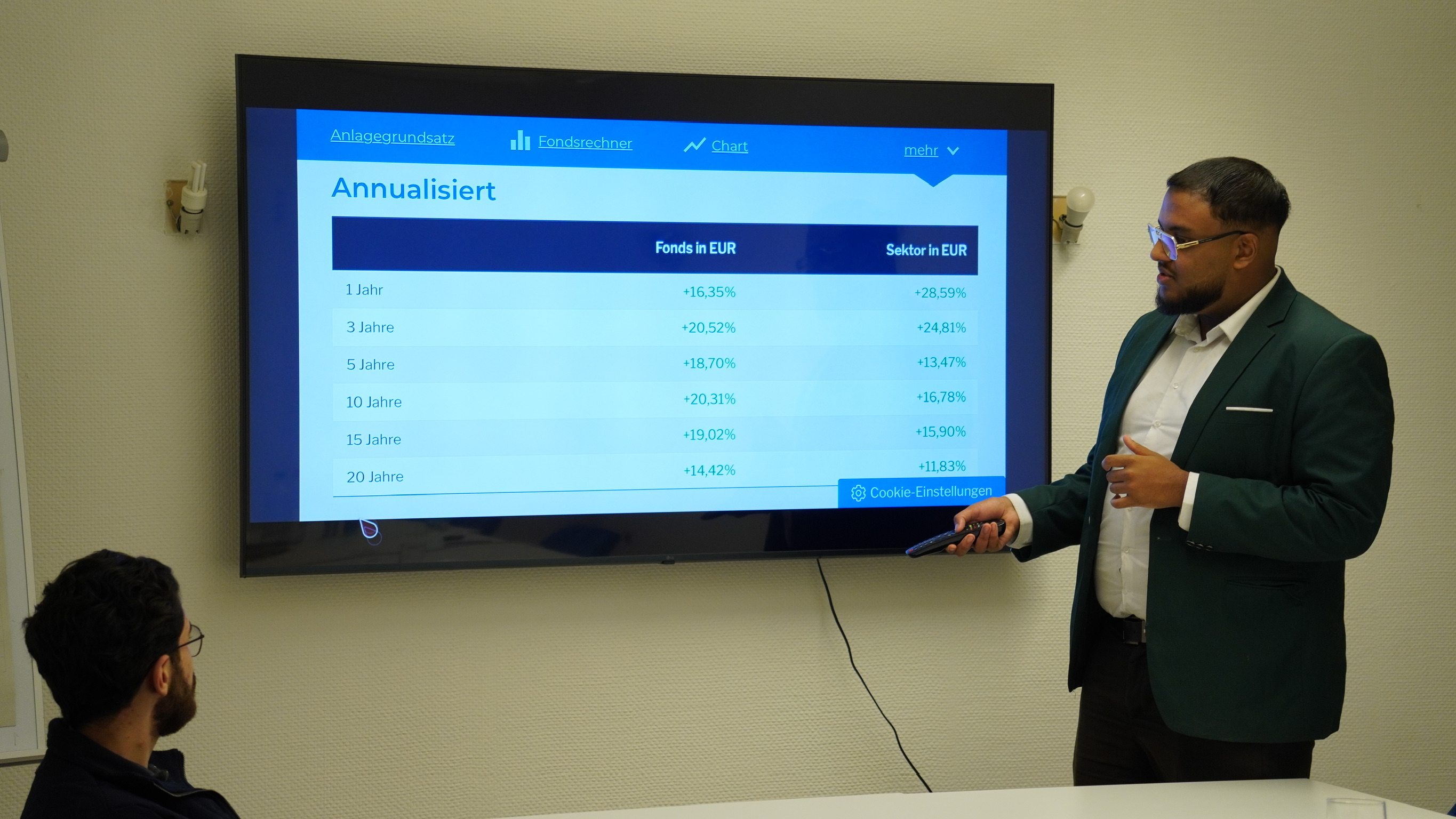 a person holding a cell phone with a chart on it