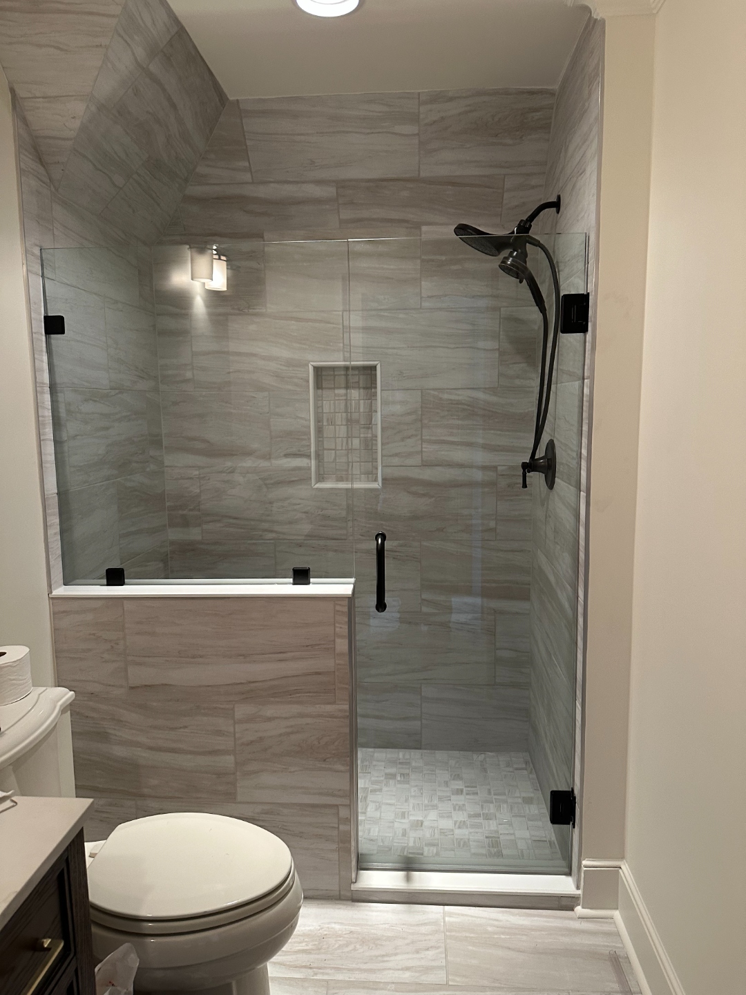 Frameless shower enclosure