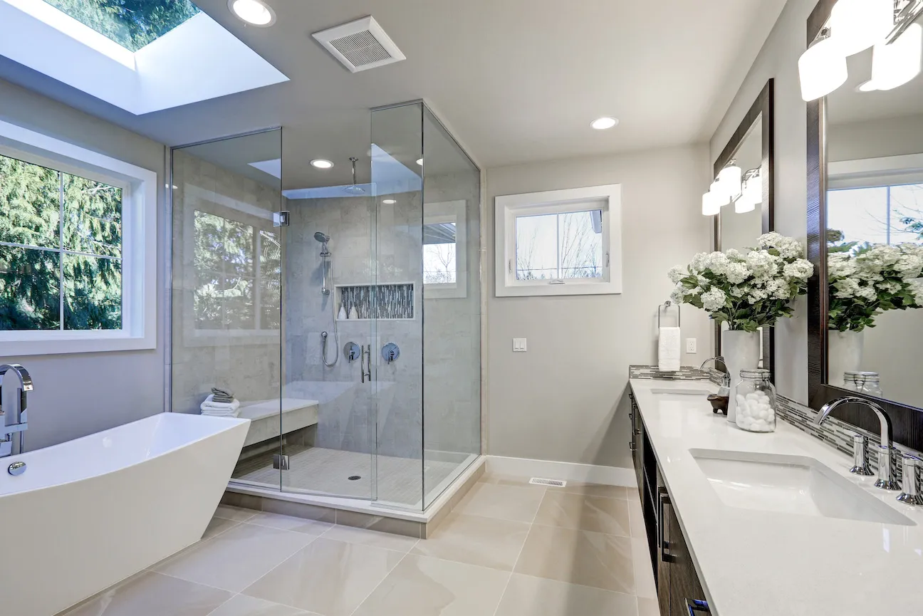 Remodeled bathroom with glass shower enclosure and freestanding tub — New Generation Handyman, Alpharetta GA