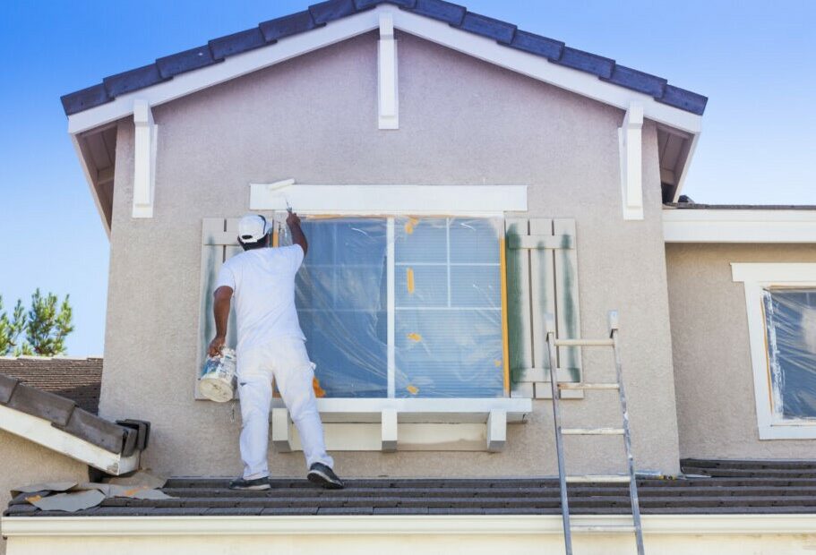 Painter applying exterior paint to home exterior — New Generation Handyman, Alpharetta GA