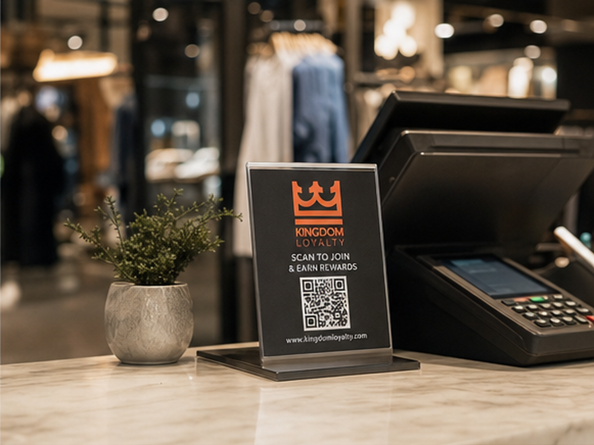 A regular scanning the Kingdom Loyalty QR code at the checkout counter to earn points on their wallet pass
