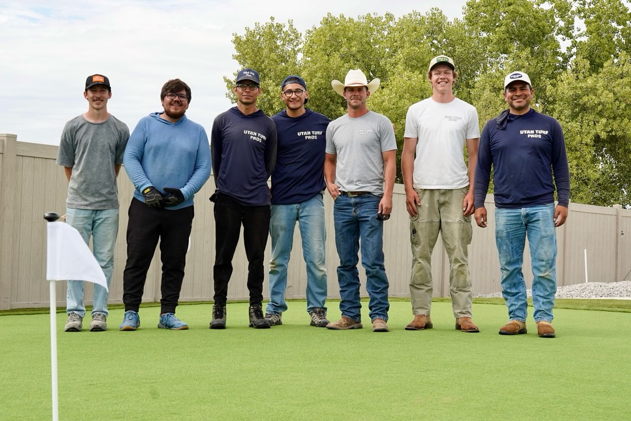 The Utah Turf Pros crew on a finished backyard putting green