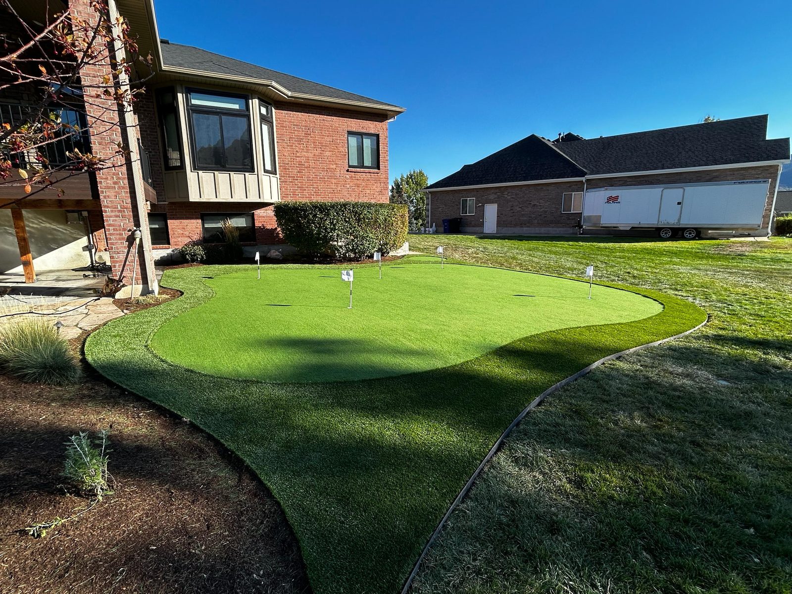 Backyard artificial turf putting green with mountain views in Utah